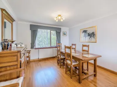 a kitchen and dining room with a table and chairs at Kilbride in Lamlash