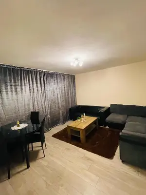 a living room with a couch and a table at Bow Church in Moffat