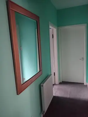 an empty room with a mirror on the wall at Pokój 1osobowy in Moffat