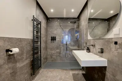 a bathroom with a sink and a shower at Modern apartment in town centre in Oban