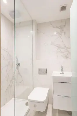 a bathroom with a shower and a toilet and a sink at 3BR Gem West End Walk to Glasgow Uni Parking in Glasgow