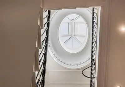 a round window in a wall in a room at Cairn BNB Introduces Blythswood Apartments - Experience exceptional luxury living in Glasgow's most desirable location in Glasgow