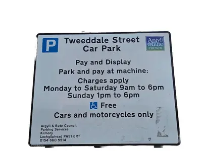 a sign for a car park with a parking meter at Central Oban 2BR Short walk to Ferries and Harbour in Oban