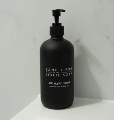 a black bottle of liquid soap sitting on a counter at Cottage in Crieff in Crieff