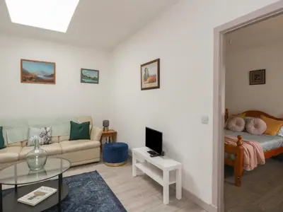 a living room with a couch and a table at Bathach Mor in Oban