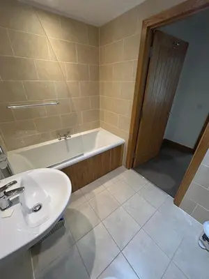 a bathroom with a sink and a bath tub at 6, The Gallops, Mains of Taymouth Estate, Kenmore in Kenmore