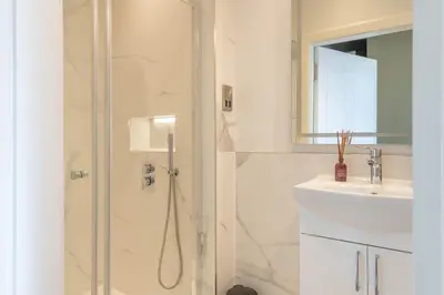 a bathroom with a shower and a sink at Wemyss Hideaway Retreat in Edinburgh