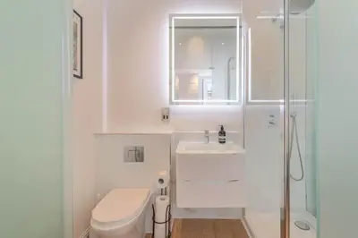 a bathroom with a toilet and a sink and a shower at Wemyss Hideaway Retreat in Edinburgh