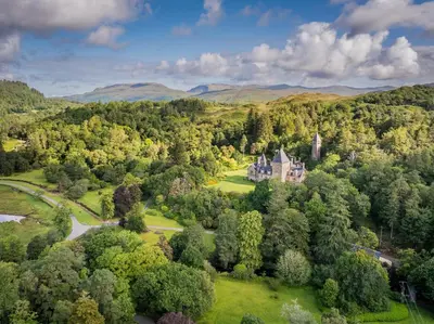 an aerial view of a castle in the forest at The Billiard Room Flat