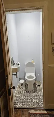 a bathroom with a toilet and a sink at Cosy 2 bedroom flat-castle view in Edinburgh