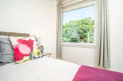 a bedroom with a bed and a window at Edinburgh Pad in Edinburgh