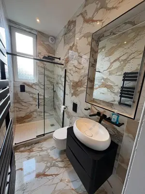 a bathroom with a toilet and a glass shower at Spacious 2 Bed Edinburgh - Perfect Location in Edinburgh