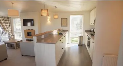 a kitchen with a counter top in a room at Luxurious Riverside Lodge - 'The Ardle' in Crieff