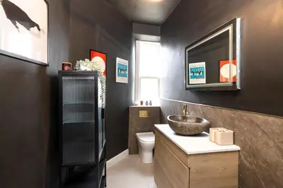 a bathroom with a sink and a toilet at Elegant Apartment in the heart of Edinburgh in Edinburgh
