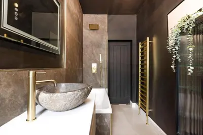 a bathroom with a large bowl sink on a counter at Elegant Apartment in the heart of Edinburgh in Edinburgh