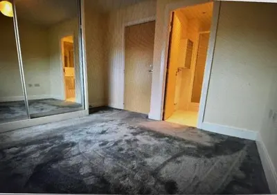 an empty room with two mirrors and a hallway at Grebe House in Moffat