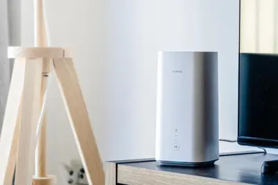 a wii speaker sitting on a table next to a monitor at Argyle Street Apartments in Glasgow