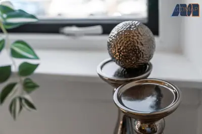 a close up of a metal vase with a ball in it at Modern 2 Bed Sleep 4 In Gourock in Gourock