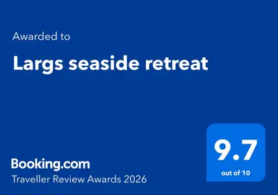 a blue sign with the words largescale retreat on it at Largs seaside retreat in Largs
