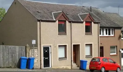 a house with a red car parked in front of it at Glen Cannich - Top Location, 2BR Accessible apt in Inverkeithing