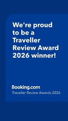 a blue sign that says were proud to be a traveller reviewagency winner at BOFA Snug Apartment in Bridge of Allan