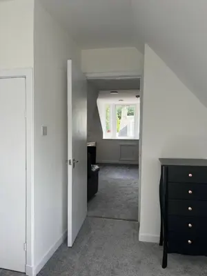 a room with a hallway with a desk and a window at Upper Mill Apartment in Newmilns