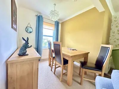 a small dining room with a table and a table and chairs at Barrmor View in Kilmartin
