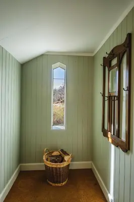 an empty room with a window and a basket at Craigendarroch No 2 in Acharn