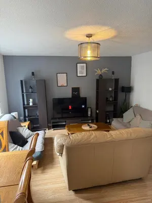 a living room with a couch and a table at City Centre 2 Bed Apartment in Glasgow