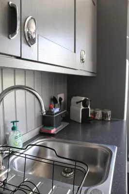 a kitchen with a sink and a counter top at Fortingall Cottage - Dalmally in Dalmally