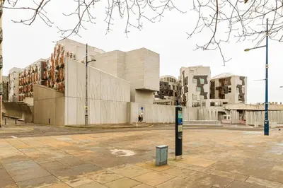 an empty parking lot in front of a building at Edinburgh City Retreat - EDINBURGH CITY CENTRE 3 min walk to Edinburgh castle in Edinburgh