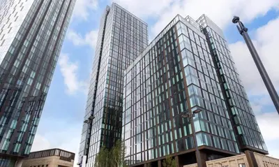 a rendering of a tall glass building at victoria resedent in Moffat