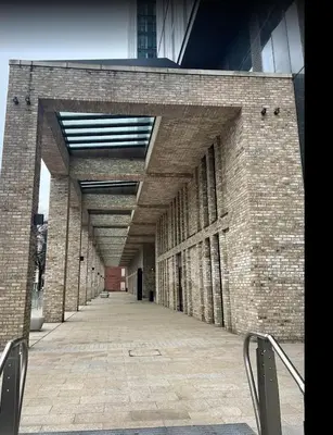 a large brick building with a long hallway at victoria resedent in Moffat