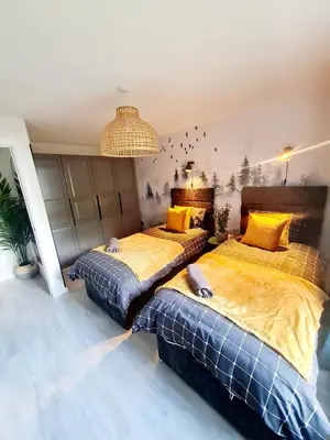 two beds sitting in a room with at Modern Apartment - FREE parking in Glasgow