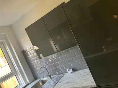 a bathroom with a sink and a shower with a mirror at Modern and stylish 3 bedroom 2 bathroom west end house with Free WiFi and parking in Scotstoun West Station