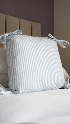 a pillow sitting on top of a bed at Pinkerton House in Dunfermline