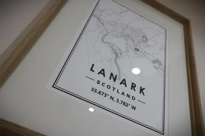a picture of a sign hanging on a wall at Signature - Wellhead View in Lanark