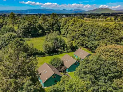an overhead view of a house in the forest at Foxglove Cottage 1 - Uk50019 in Drymen