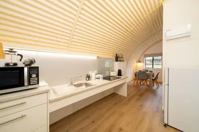a kitchen with a sink and a microwave at Cultybraggan Hut 38 - Accessible in Comrie