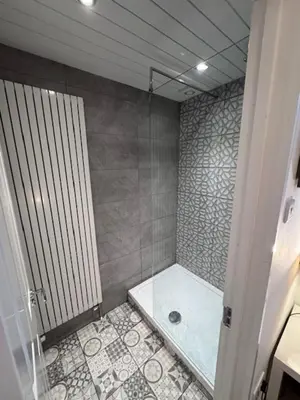 a bathroom with a shower with a tub and a shower at Balloch But & Ben in Balloch