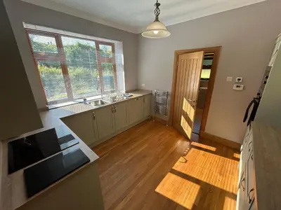an empty kitchen with a sink and a window at Shawsmill, outside Hurlford in Hurlford