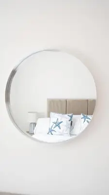 a bedroom with a mirror above a bed at 4 BDR House By Caledonia Luxe Stays Short Lets & Serviced Accommodation Livingston in Livingston