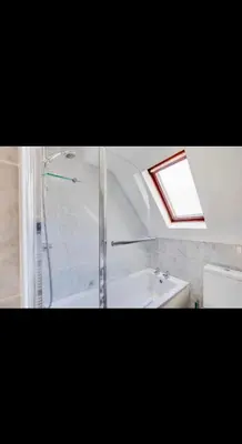 a bathroom with a shower and a sink at Modern home Close to all Cardiff venues in Moffat