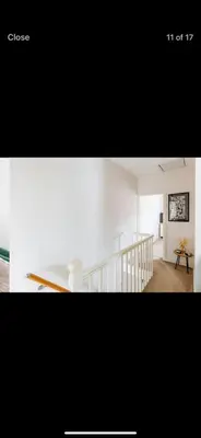 a living room with a staircase and a white room at Private room - Central NN1 stay in Moffat