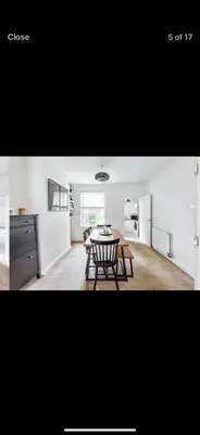 a kitchen and dining room with a table and chairs at Private room - Central NN1 stay in Moffat