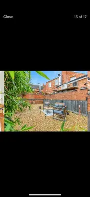 two picnic benches in a yard with a building at Private room - Central NN1 stay in Moffat