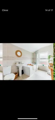 a bathroom with a sink and a tub and a toilet at Private room - Central NN1 stay in Moffat