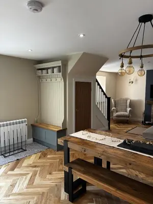 a living room with a table and a couch at No4 Invereoch in Arrochar