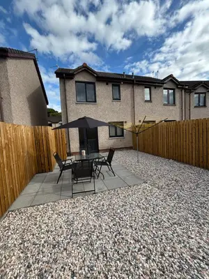 a patio with a table and chairs and a fence at 25 Colliers Road,Stirling