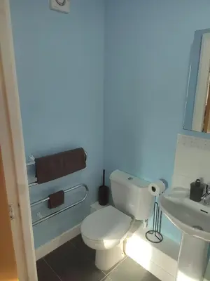 a bathroom with a white toilet and a sink at Rosebank Apartment Edinburgh City in Edinburgh